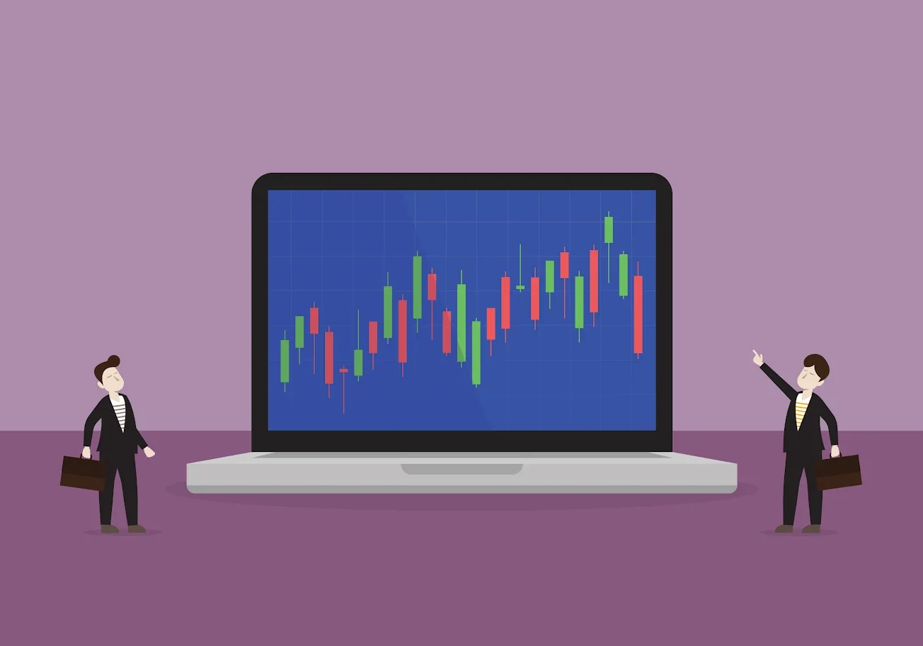 Laptop showing colorful stock market chart on screen.